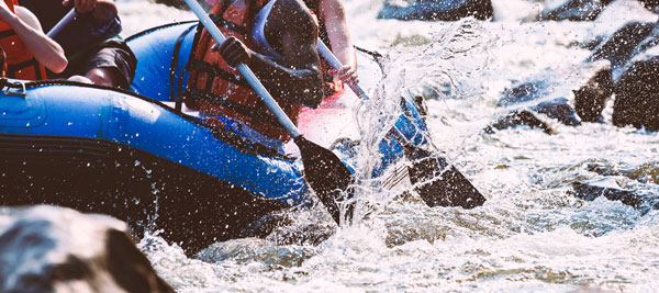 group young people are rafting river close up